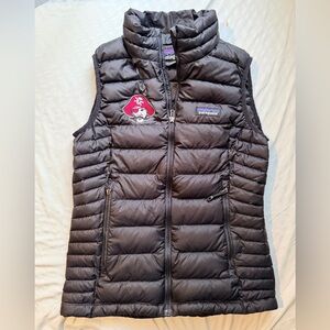 Patagonia Black Quilted Vest with Pirate Patch